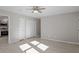 Well-lit bedroom with double door closet and ceiling fan at 1205 Pecan Pl, Durham, NC 27704