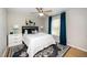 Cozy bedroom with hardwood floors, ceiling fan and window coverings at 1320 S State Street # D, Raleigh, NC 27610