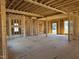 Under-construction home interior, framing the main living area with large windows at 142 Batten Hill Ln, Selma, NC 27576