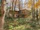 House nestled in a wooded area at 1505 Primrose Ln, Cary, NC 27511