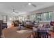 Living room featuring hardwood floors, comfy furniture, and a view to deck at 161 Pine Cone Dr, Oxford, NC 27565