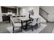 Bright dining area with kitchen and staircase views at 1739 Aspen River Lane, Apex, NC 27502