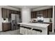 Modern kitchen with stainless steel appliances and island at 1739 Aspen River Lane, Apex, NC 27502