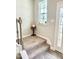 Carpeted stairs with simple wooden railing at 2177 Campbell Loop, Burlington, NC 27215