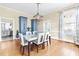 Bright dining room with hardwood floors, a large table and built-in cabinets at 220 S Fayetteville St, Clayton, NC 27520