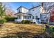 Two-story white house with a large backyard and deck at 220 S Fayetteville St, Clayton, NC 27520