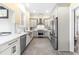 Modern kitchen with stainless steel appliances and white shaker cabinets at 220 S Fayetteville St, Clayton, NC 27520