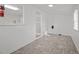 Bright laundry room with linoleum floor and access to other rooms at 2220 May Dr, Burlington, NC 27215