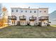 Four-unit townhouse building, rear view, showing private decks and yards at 2606 Wyntercrest Ln, Durham, NC 27713