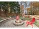 Cozy patio area with fire pit and seating at 312 Teal Lake Dr, Holly Springs, NC 27540