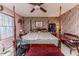 Spacious bedroom with a king-size bed and floral wallpaper at 4216 New Hill Holleman Rd, New Hill, NC 27562