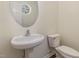 Powder room with pedestal sink and toilet at 526 Elm Ave, Wake Forest, NC 27587