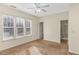 Spacious bedroom with large windows and carpet at 526 Elm Ave, Wake Forest, NC 27587