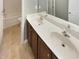 Bathroom with double vanity and neutral tile flooring at 6 Heatherford Ct, Durham, NC 27704