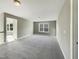 Spacious bonus room with carpet, neutral walls and added window at 6 Heatherford Ct, Durham, NC 27704