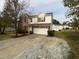 Brick two-story house with attached garage and landscaping at 6 Heatherford Ct, Durham, NC 27704