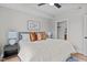 Relaxing main bedroom with plush bedding, bedside tables, and access to a closet at 615 W Peace St # 302, Raleigh, NC 27605