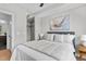 Main bedroom with walk-in closet, ensuite bathroom, and comfortable bed at 615 W Peace St # 302, Raleigh, NC 27605