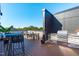 Rooftop patio with outdoor kitchen, dining area, and city views at 615 W Peace St # 302, Raleigh, NC 27605