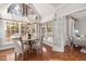 Charming breakfast nook with a round table and access to the backyard at 6204 Chatford Dr, Raleigh, NC 27612