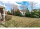 Large backyard with mature trees and open lawn space at 628 Peach Orchard Pl Pl, Cary, NC 27519