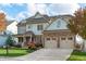 Two-story house with two-car garage and manicured lawn at 628 Peach Orchard Pl Pl, Cary, NC 27519