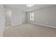 Spacious bedroom with carpet, neutral walls, and a walk-in closet at 644 Barneswyck Dr, Fuquay Varina, NC 27526