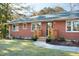 Attractive front entry with new wooden steps and landscaping at 6506 Garrett Rd, Durham, NC 27707