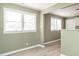 Light-filled dining area with light green walls and wood-look flooring at 808 Trail One, Burlington, NC 27215