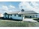 Charming white house with gray roof, carport, and landscaped lawn at 814 Burlington Avenue Ave, Gibsonville, NC 27249