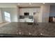 Granite countertop kitchen island with sink and modern appliances at 842 Parc Townes Dr # 64, Wendell, NC 27591