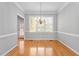 Dining room with hardwood floors and chandelier at 100 Hickory Glen Ln, Holly Springs, NC 27540