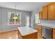 Bright kitchen with breakfast nook and access to backyard deck at 100 Hickory Glen Ln, Holly Springs, NC 27540