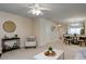 Spacious living room featuring a ceiling fan and ample natural light at 100 Stratford Lakes Dr # 306, Durham, NC 27713