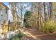 Landscaped backyard with wooded area at 108 Pointe Crest Ct, Cary, NC 27513