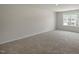 Spacious bedroom with large window and neutral carpeting at 1136 Middlecrest Dr, Rocky Mount, NC 27804