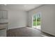 Dining area with sliding glass doors leading to backyard at 1136 Middlecrest Dr, Rocky Mount, NC 27804
