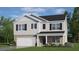 Two-story home with gray siding, brick accents, and a two-car garage at 1136 Middlecrest Dr, Rocky Mount, NC 27804