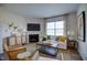 Comfortable living room featuring a fireplace and large window at 1140 Middlecrest Dr, Rocky Mount, NC 27804