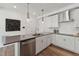 Modern kitchen with white cabinets and gray countertops at 1223 Shaw View Alley # 101, Raleigh, NC 27601