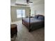 Main bedroom with post bed and carpet flooring at 1911 Huntley Way, Burlington, NC 27215