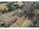 Aerial view of property highlighting house and outbuildings at 2601 Chestnut Ridge Church Rd, Efland, NC 27243