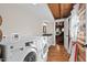 Bright laundry room with washer, dryer, and built-in storage at 2601 Chestnut Ridge Church Rd, Efland, NC 27243