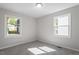 Well-lit bedroom with carpet and neutral walls at 2612 Glenbrook Dr, Durham, NC 27704