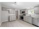 Modern kitchen with gray cabinets and stainless steel appliances at 262 Homestead Dr, Selma, NC 27576