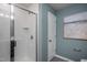 Modern bathroom with a walk-in shower and white subway tiles at 2782 Farmhouse Dr, Apex, NC 27502