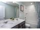 Double vanity bathroom with a bathtub and a large mirror at 2782 Farmhouse Dr, Apex, NC 27502