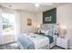 Cozy bedroom with a unique headboard, green accents, and plenty of light at 2782 Farmhouse Dr, Apex, NC 27502