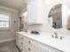 Elegant bathroom boasts double vanity, large mirror, and a shower at 297 Denvale Dr, Selma, NC 27576