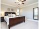 Spacious bedroom with a king-size bed, large windows, and neutral decor at 297 Denvale Dr, Selma, NC 27576